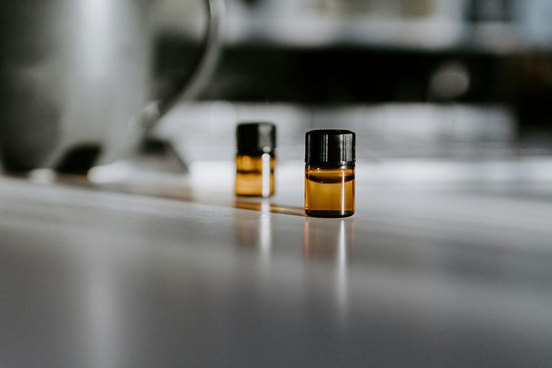 Two small vials of liquid fish oil.