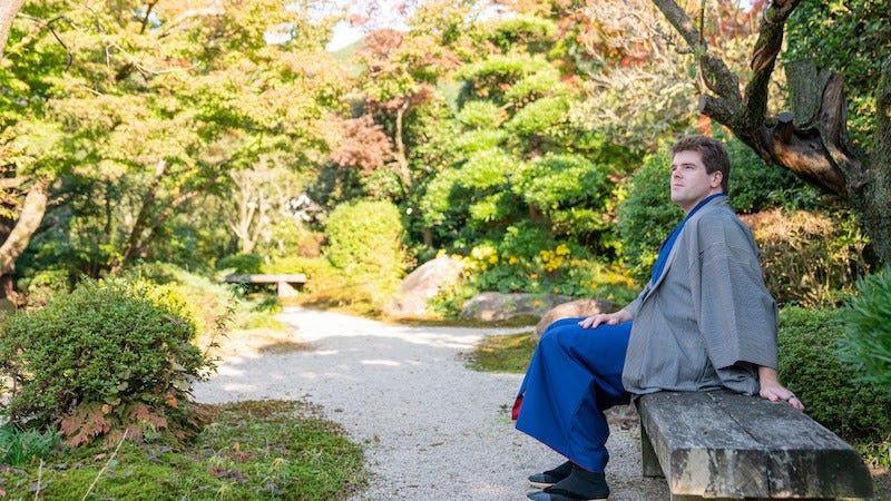 Donny Kimball sits in a Japanese garden in Asakura’s area of Akizuki.