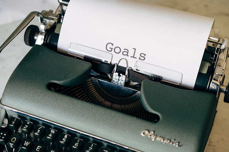 the word "goals" is written on a piece of paper