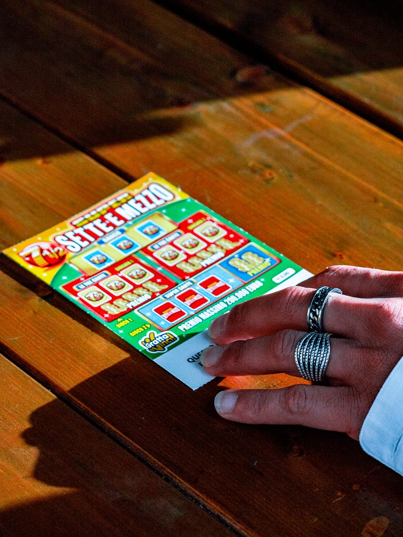 A scratch off lotto ticket on a table.