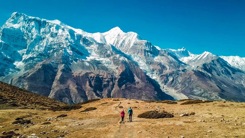 Trekkers hiking towards Thorang-La pass 5416m