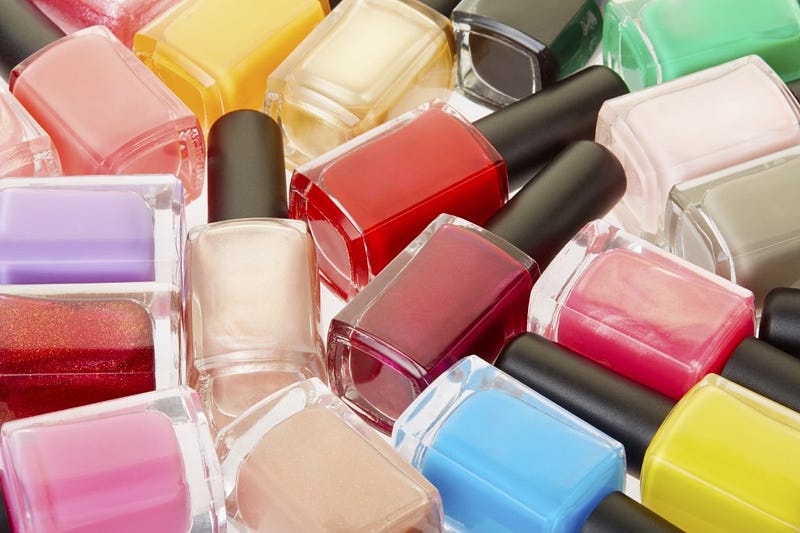 Nail polish colorful bottles background