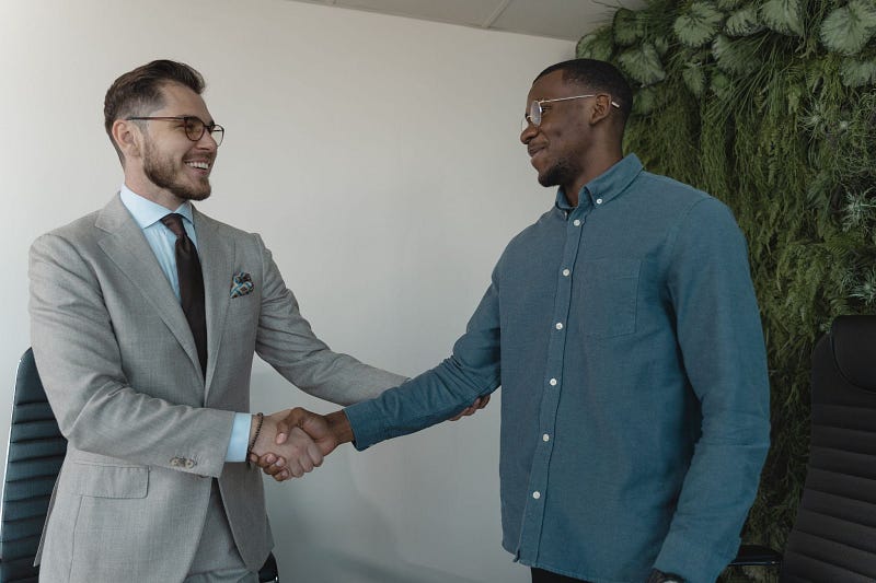 two people shaking hands after a successful recruitment