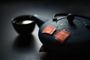 teapot with green tea in it
