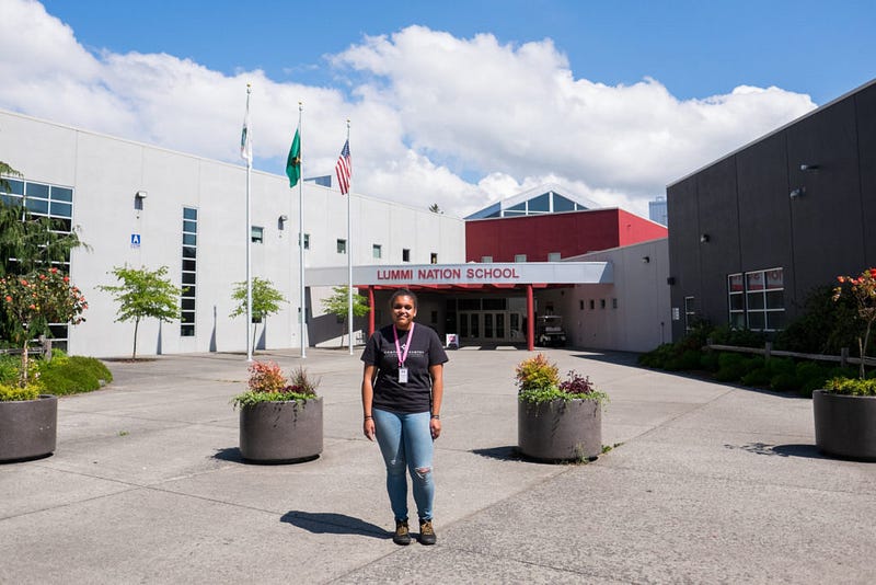 Monea Kerr, a lead mentor for Western’s Compass 2 Campus program, stands in front of the Lummi Nation School where she mentors students. Kerr was inspired by LaFortune’s enthusiasm and passion for teaching.