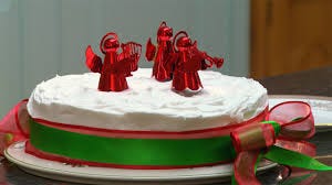 Side covered with decorative green lace and top showing many Santa celebrating coming of Jesus