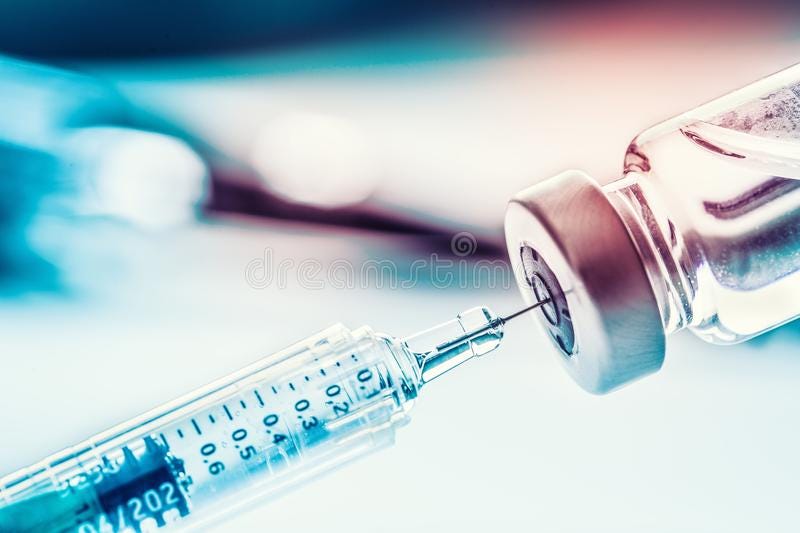 A syringe and ampule