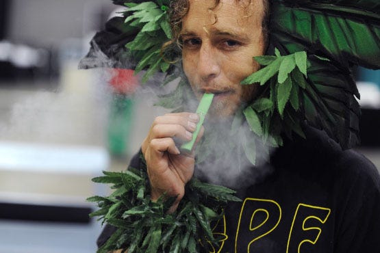 A man calling himself Henry Hemp inhales marijuana using a vaporizer pen at HempCon medical marijuana show, May 24, 2013 at the Los Angeles Convention Center. Thousands of marijuana enthusiasts gathered for the three-day event for exhibits of medical marijuana dispensaries, collectives, evaluation services, legal services and equipment and accessories. Under California state law, people suffering from chronic diseases have the right to grow, buy and use marijuana for medical purposes when recommended by a doctor. In 2003 the Medical Marijuana Protection Act, established an identification card system for medical marijuana patients. AFP PHOTO / ROBYN BECK