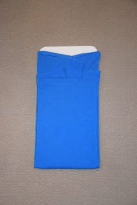 Blue t-shirt being folded
