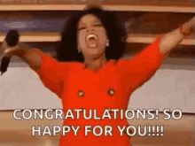 Oprah Winfrey congratulating in red dress