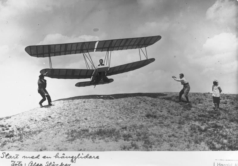 A plane in early XXth century is starting to fly