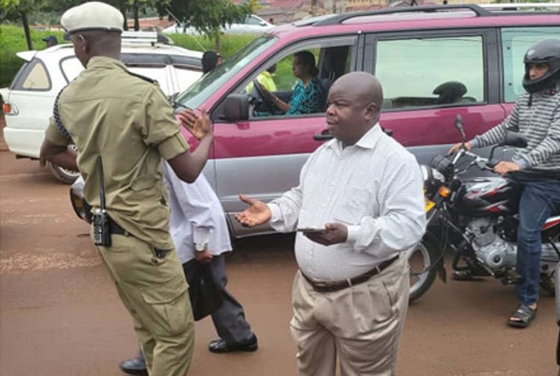 Negotiating with police during a recent crackdown. Credit: The Daily Monitor.
