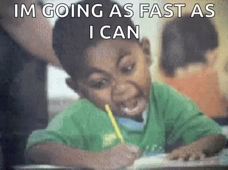 Image Description: GIF of a boy in a green shirt, wide eyes, and open mouthed, holding a yellow pencil and writing frantically with the phrase “I’M WRITING AS FAST AS I CAN.”