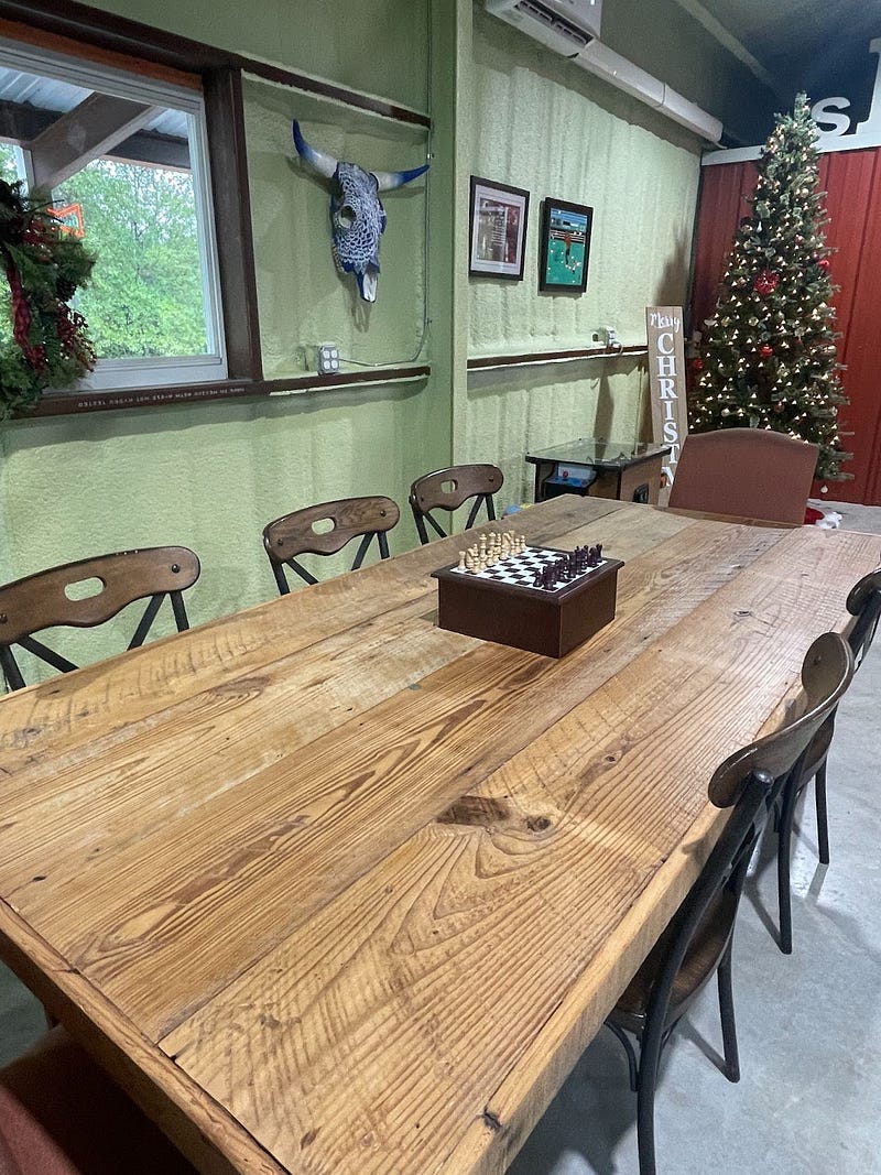 wooden dining table in Kirk and Shannon's Bedias Barndominium
