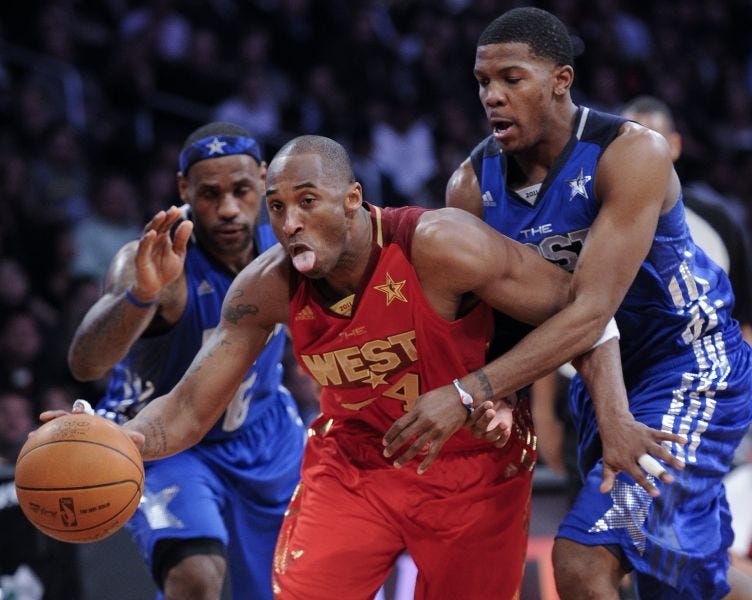 Kobe Bryant (middle) drives past Joe Johnson and LeBron James during the 2011 NBA All-Star Game.