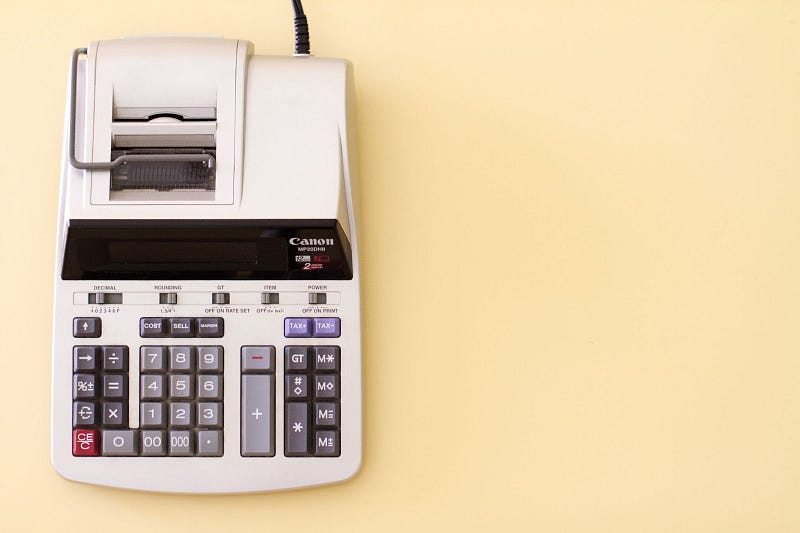 a white Canon printing calculator