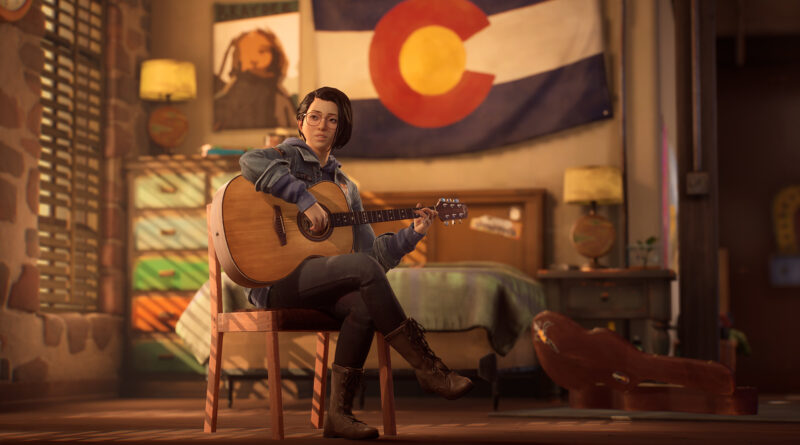 Alex, a young woman, sits on a chair in a bedroom and plays her acoustic guitar. The flag of Colorado hangs behind her bed. Light from a window behind her pours in through half-drawn blinds.