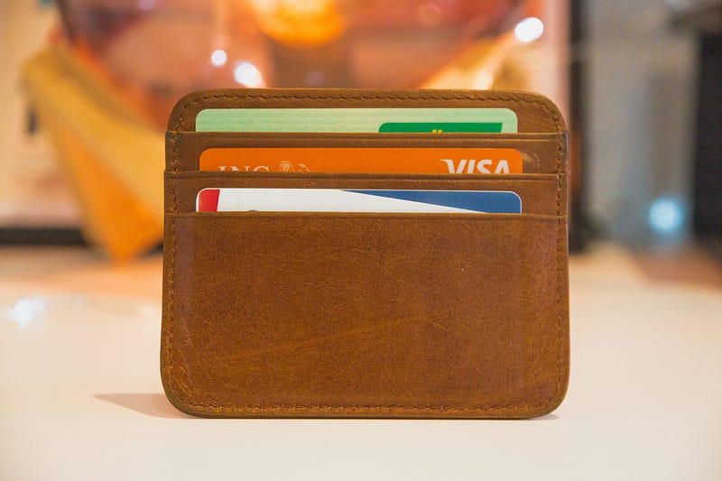Brown wallet with multiple credit cards.