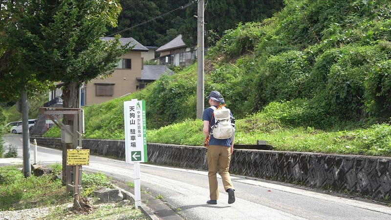 Tim Bunting AKA Kiwi Yamabushi walks to the trailhead of Tengu-yama from its carpark along the narrow country road.