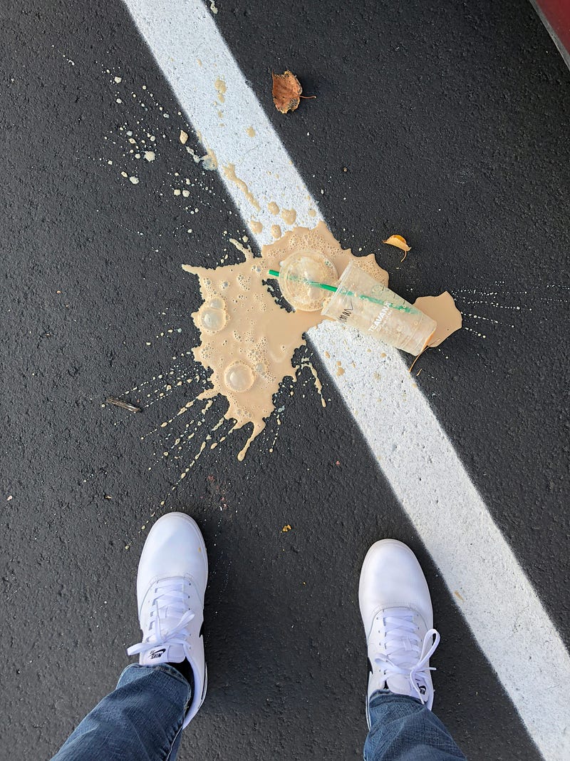Iced coffee spilled on asphalt