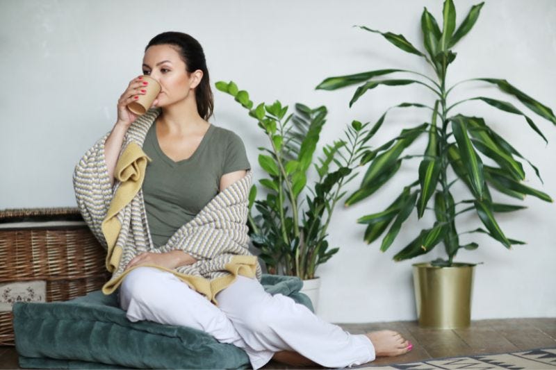 Woman drinking green tea to relax