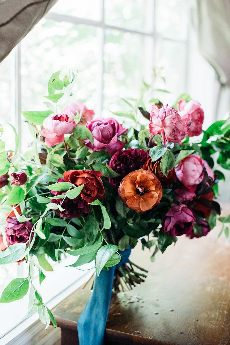 bouquet with oranges and pinks - http://ruffledblog.com/fiesta-inspired-san-diego-wedding