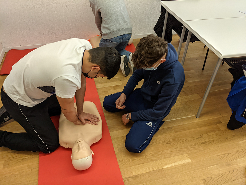 people ensuring workplace safe by doing CPR training