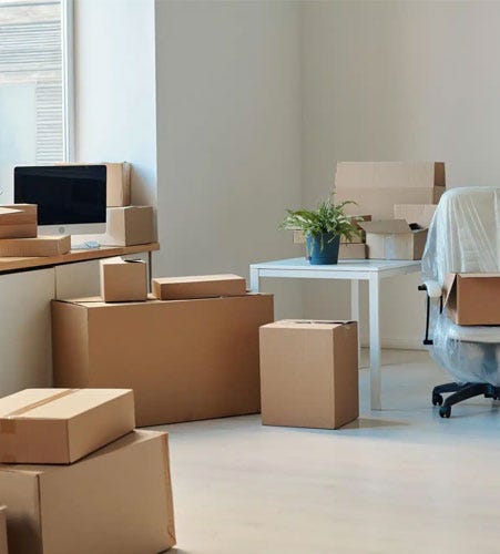 Commercial office movers packing desks and furniture in Melbourne