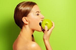 pretty girl eating apple