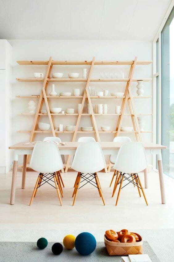 White Scandinavian dining room with open shelving