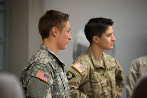 Two female soldiers in uniform.