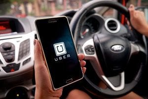 man holding uber phone