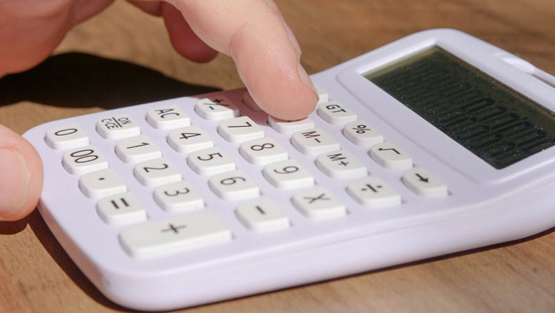 employee using a calculator