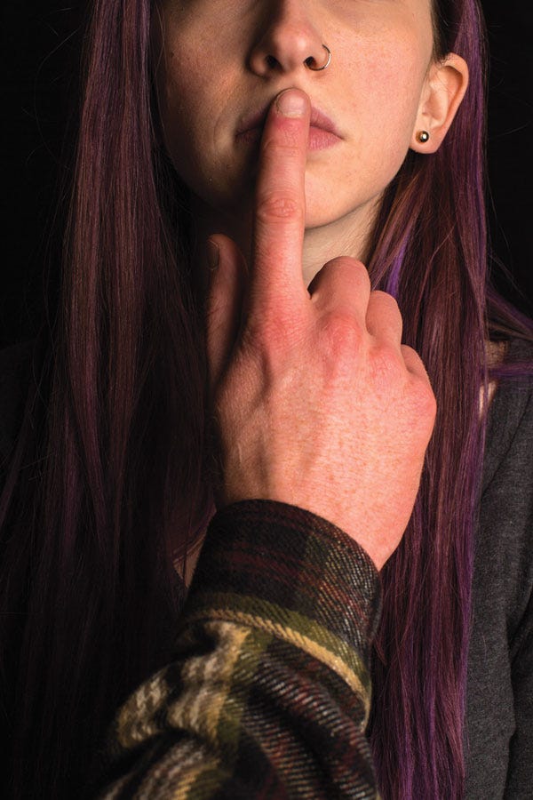 Photo illustration of a girl with man's hand on her mouth