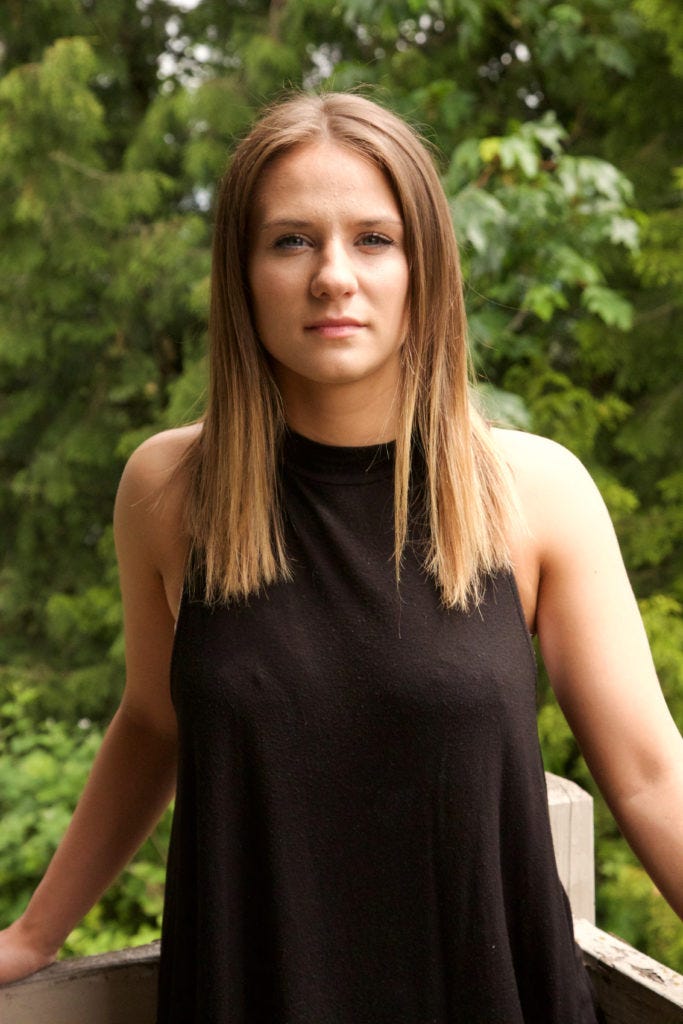  Jessica Eikenberry, 20, poses for a portrait outside her home in Everett, Washington. Eikenberry lost her identical twin sister to a tragic car accident on March 15, 2016 and has since been focusing on making it through each day and reaching for her goals in order to make her twin sister proud. Photo by Lauren Prater 