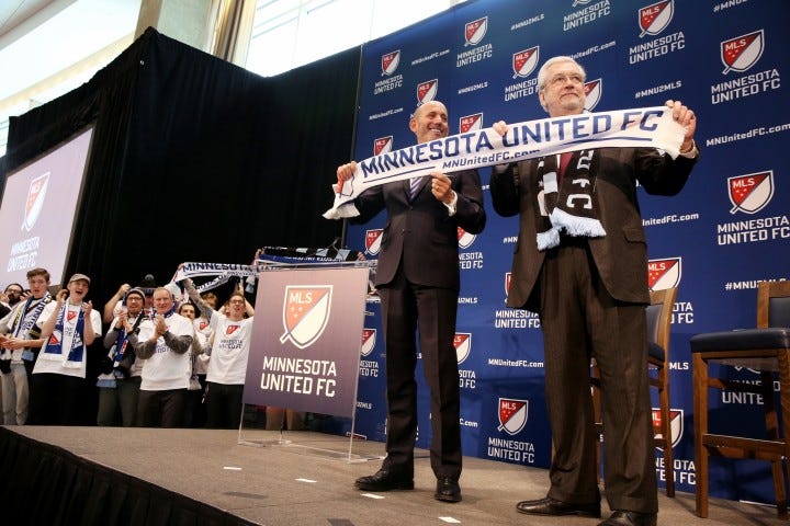 Major League Soccer Commissioner Don Garber, left, and Dr. Bill McGuire announce that Minnesota United FC will move to MLS at Target Field in Minneapolis on Wednesday, March 25, 2015. ] LEILA NAVIDI leila.navidi@startribune.com /