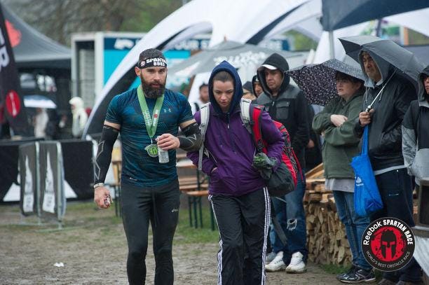 Cold and happy to have my first Spartan Beast completed. With my girl, Kerri Driscoll, who braved it out waiting for me in the cold, mud and rain.