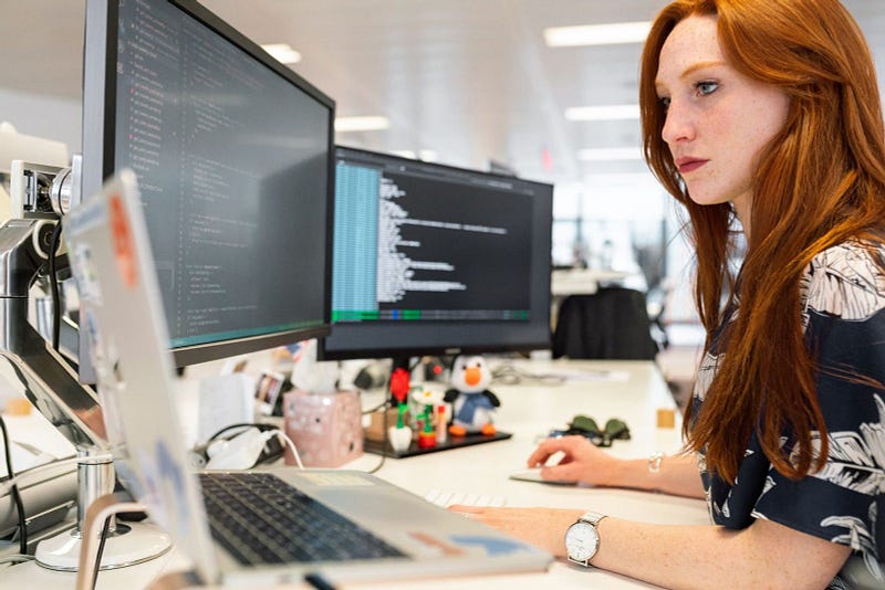 woman working in front of her computer | procure-to-pay