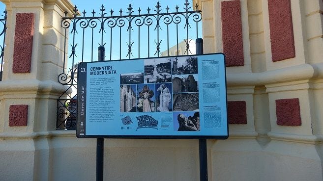 A small signboard with information on Modernist Cemetery