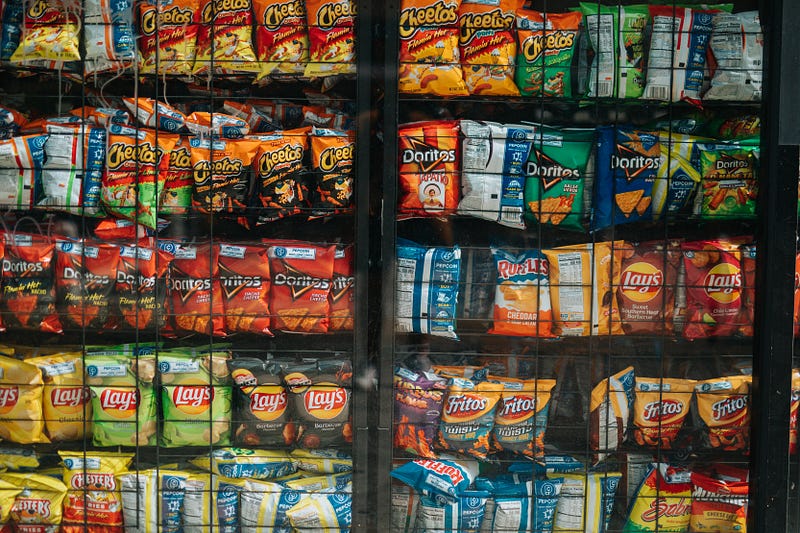 vending machines filled with chips, crackers, and junk food