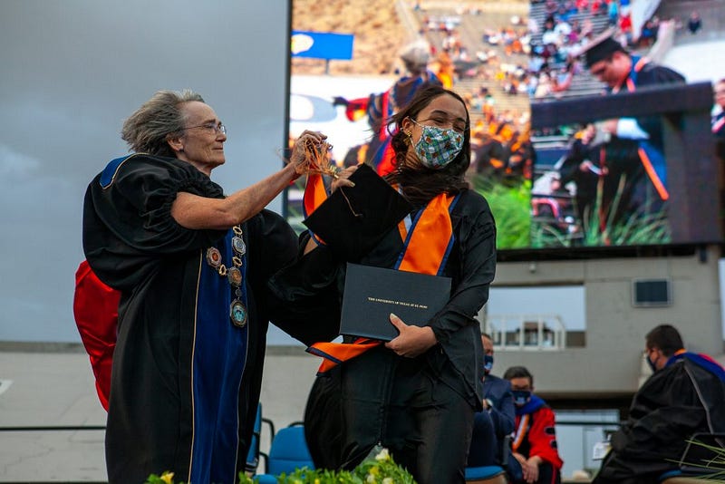 Decorated graduation caps denote pride in family, education in El Paso