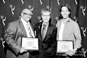 Laney Media Communications students Michael Cotton (left) and Ryan Fioroni flank Professor Steve Shlisky with certificates of their scholarships, which they received on Oct. 24 in San Francisco.