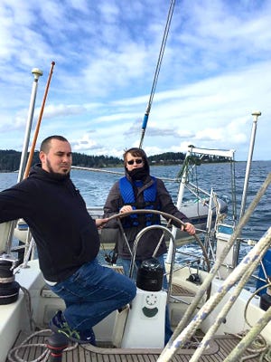 At the helm.