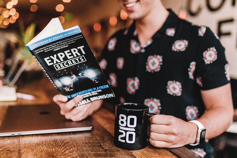 a person holding a book about expert power