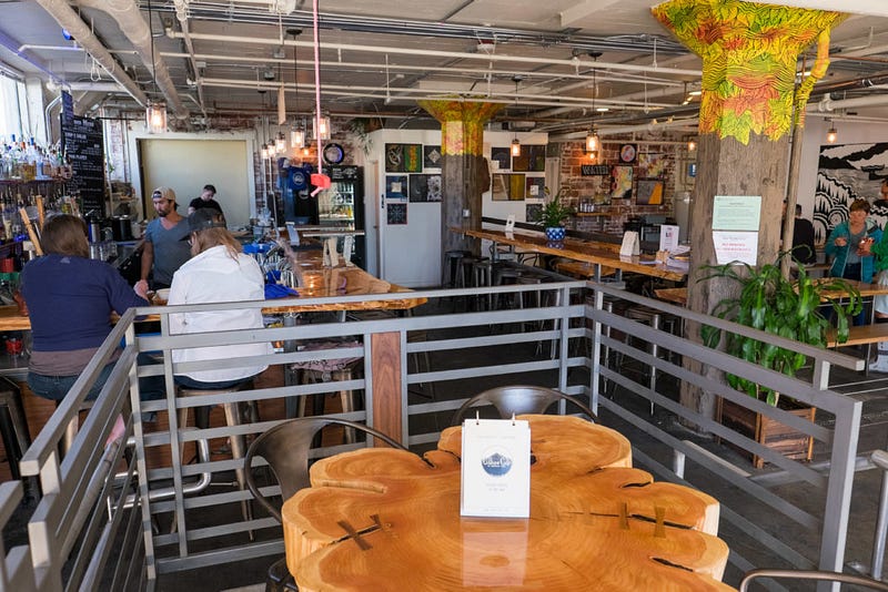 Customers sit in the open-air atmosphere of the Culture Cafe at Kombucha Town on 210 Chestnut St. in downtown Bellingham.