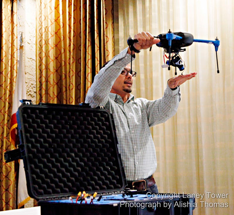 freelance photographer Carl Costas shows off his drone during a workshop