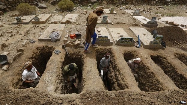 Yemeni citizens dig graves for those killed as a result of the Saudi invasion.