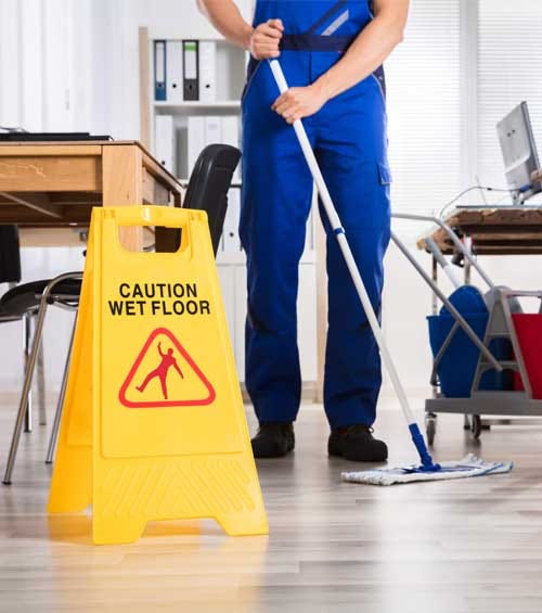 Staff performing detailed workstation cleaning under the Best Office Cleaning Services