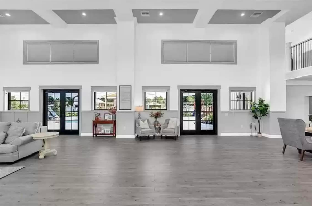 Open-layout living space of Osceola County, Florida Barndominium by Leslie Mintrone 
