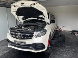 Certified mechanic performing logbook service in Canberra